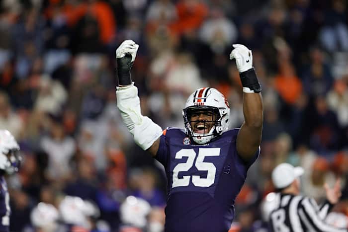 Nov 12, 2022; Auburn, Alabama, USA; Auburn Tigers defensive end Colby Wooden (25) tries to get the fans excited starting the fourth quarter against the Texas A&M Aggies at Jordan-Hare Stadium. Mandatory Credit: John Reed-USA TODAY Sports